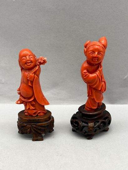 Reunion of two carved red coral subjects,...