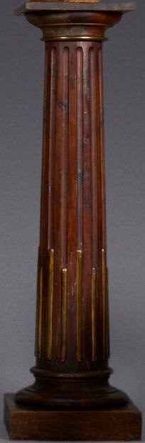 Stained pine sellette in the form of a fluted...