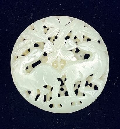 Celadon nephrite jade medallion with carved...