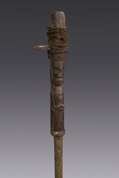 Wooden shaman's cane carved with a figure...