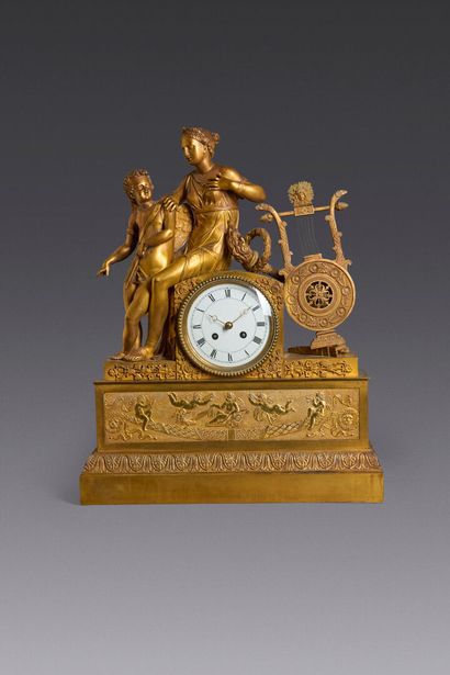 Chased and gilt bronze terminal clock. Enameled...