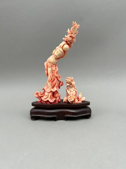 Stained coral double subject with carved...