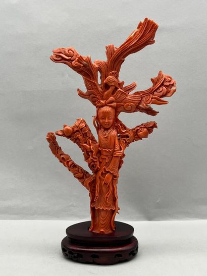 Red coral subject on a wooden base with carved...