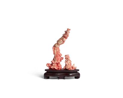 Stained coral double subject with carved...