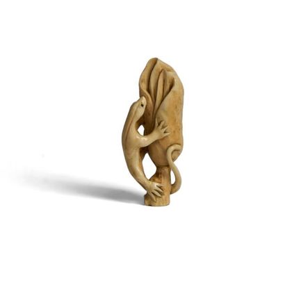 Ivory netsuke featuring a salamander climbing...