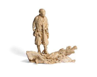 Important ivory okimono depicting a trapper...
