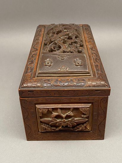 Rectangular wooden box carved on all sides...