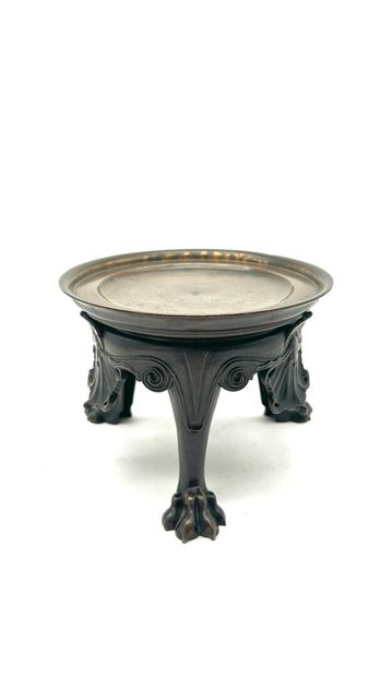 Bronze tripod base, the round top rests on...