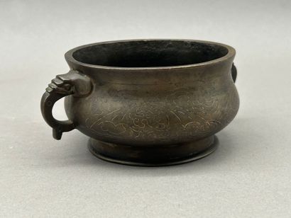 Small bronze incense burner with two handles...