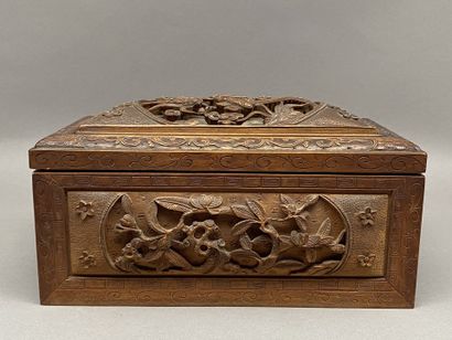 Rectangular wooden box carved on all sides...