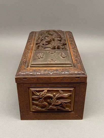 Rectangular wooden box carved on all sides...