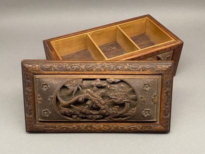 Rectangular wooden box carved on all sides...