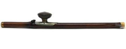 *Bamboo opium pipe and its reddish-brown...