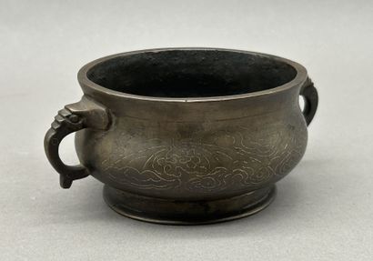 Small bronze incense burner with two handles...