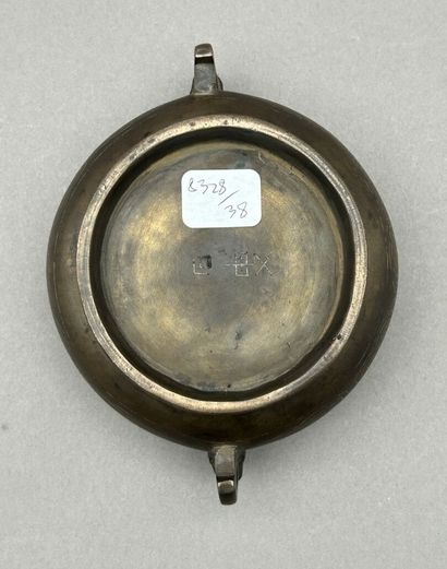 Small bronze incense burner with two handles...