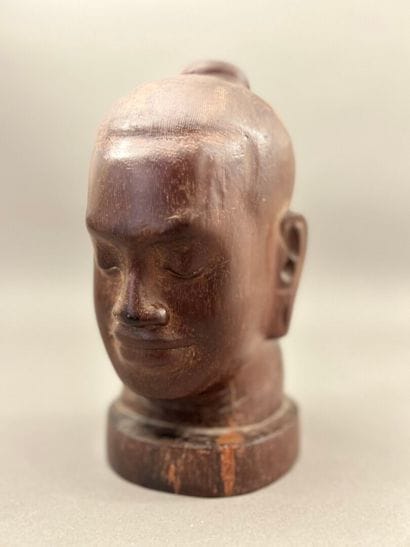 Carved wooden head of Jayavarman. The head...