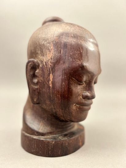 Carved wooden head of Jayavarman. The head...