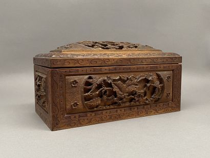 Rectangular wooden box carved on all sides...