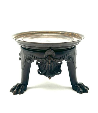 Bronze tripod base, the round top rests on...