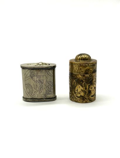 Set of two opium boxes.
- A cylindrical brass...