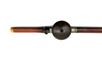 *Bamboo opium pipe and its reddish-brown...