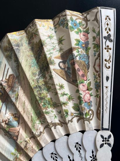 Wallpaper fan with a gallant scene on one...