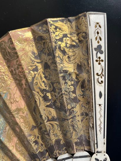 Wallpaper fan with a gallant scene on one...