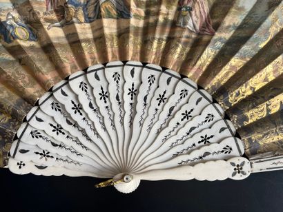 Wallpaper fan with a gallant scene on one...