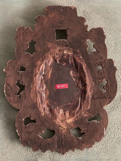 *Small curved mirror in molded, carved, stuccoed...