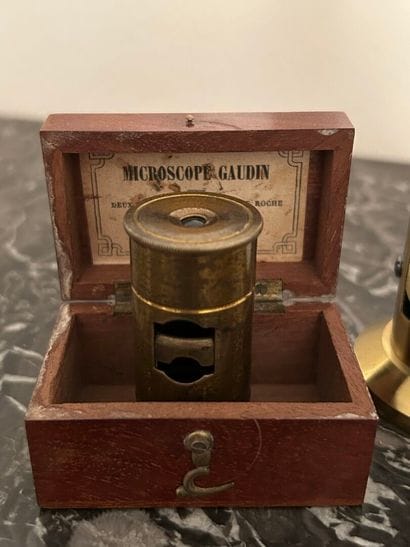 *A collection of brass scientific instruments,...