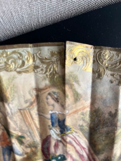 Wallpaper fan with a gallant scene on one...