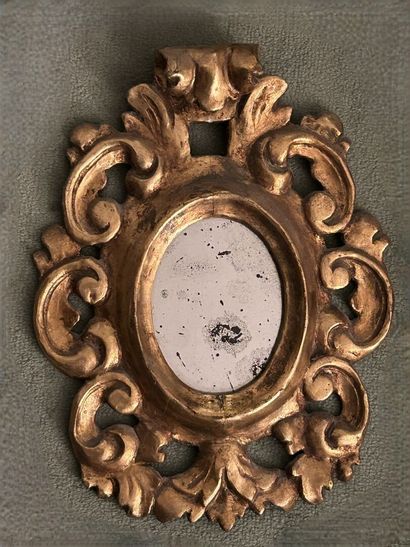 *Small curved mirror in molded, carved, stuccoed...