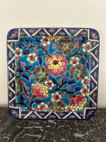 *LONGWY. 
Small glazed earthenware square...
