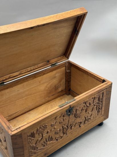 Rectangular wooden box with carved decorations...