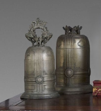 A pair of ceremonial bells made of patinated...