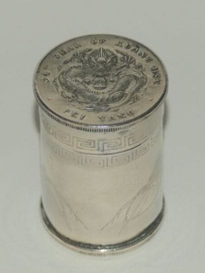A cylindrical opium box made of silver-plated...