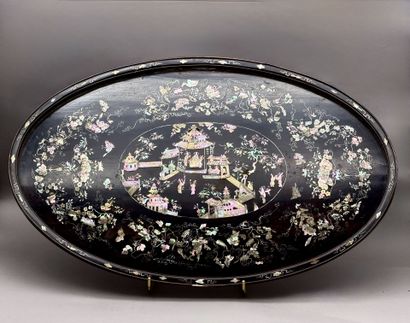 A set of three oval trays made of exotic...