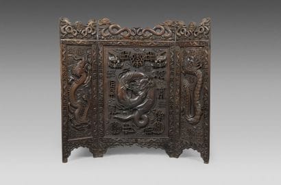 A three-panel screen made of exotic wood,...