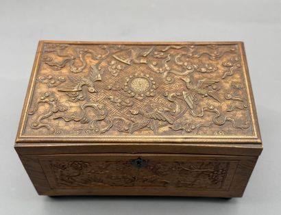 Rectangular wooden box with carved decorations...