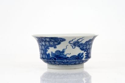Flared bowl on a foot, made of blue-and-white...