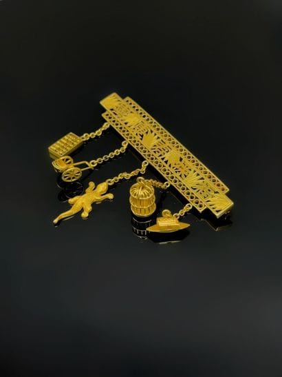 A 750°/°° (18K) gold brooch-barrette featuring...