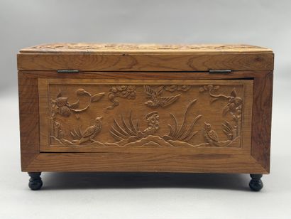 Rectangular wooden box with carved decorations...