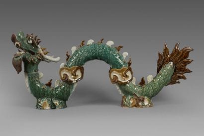 A partially glazed polychrome stoneware ridge...
