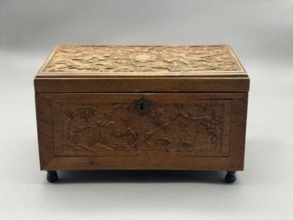 Rectangular wooden box with carved decorations...