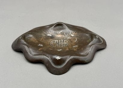 Bronze lotus-leaf-shaped incense burner base...