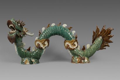 A partially glazed polychrome stoneware ridge...