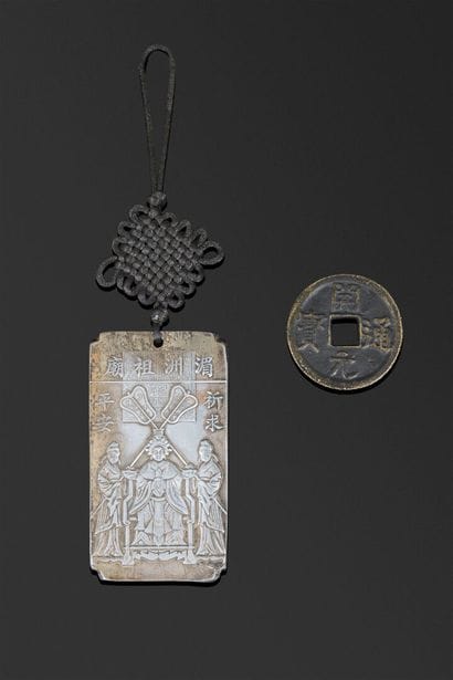 A rectangular plaque with beveled edges,...