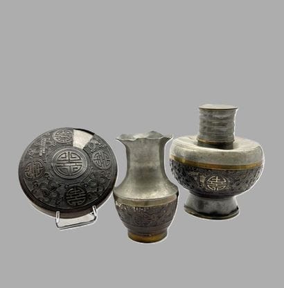Set of three chiseled pewter objects comprising...