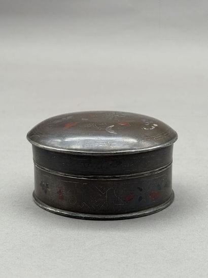 Round, lidded bronze box decorated with silver...