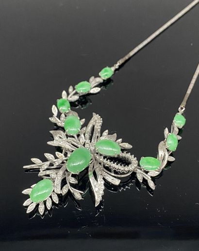 A draped metal necklace with a bamboo-style...